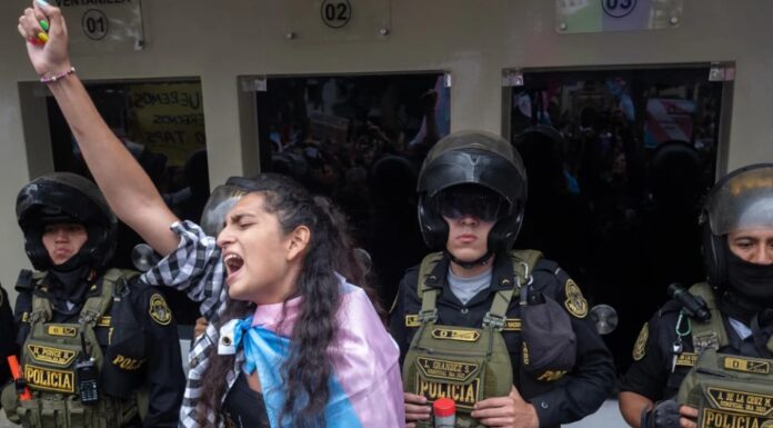 Peru Makes Transgender Identity a Mental Health Issue in New Policy Protestor in Peru protesting mental health issues due to new law about transgenders.