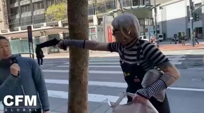 Preacher Doesn’t Flinch as Activist Points Apparent Gun at His Head Preacher doesn't flinch as a gun is pulled on him.