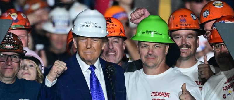 Blue-Collar wage growth under President Trump as he poses with blue collar workers.