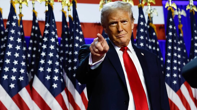 President Trump pointing at fans.