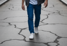 The Inflation Generation’s Playbook for Money and Power Young person navigating cracked city sidewalk.